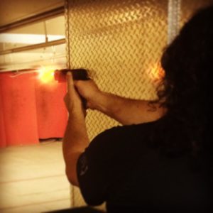 The author at the gun range with his 1911 .45 pistol.